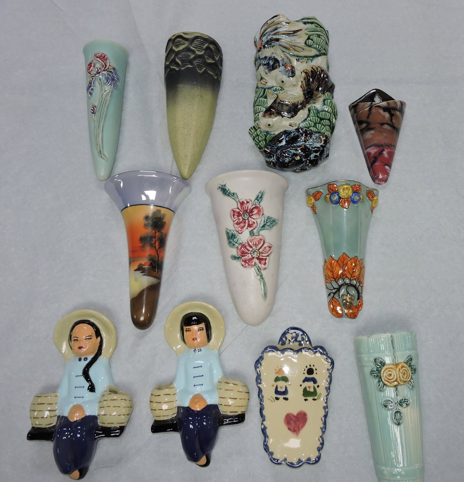 Lot of 11 pottery wall pockets: .