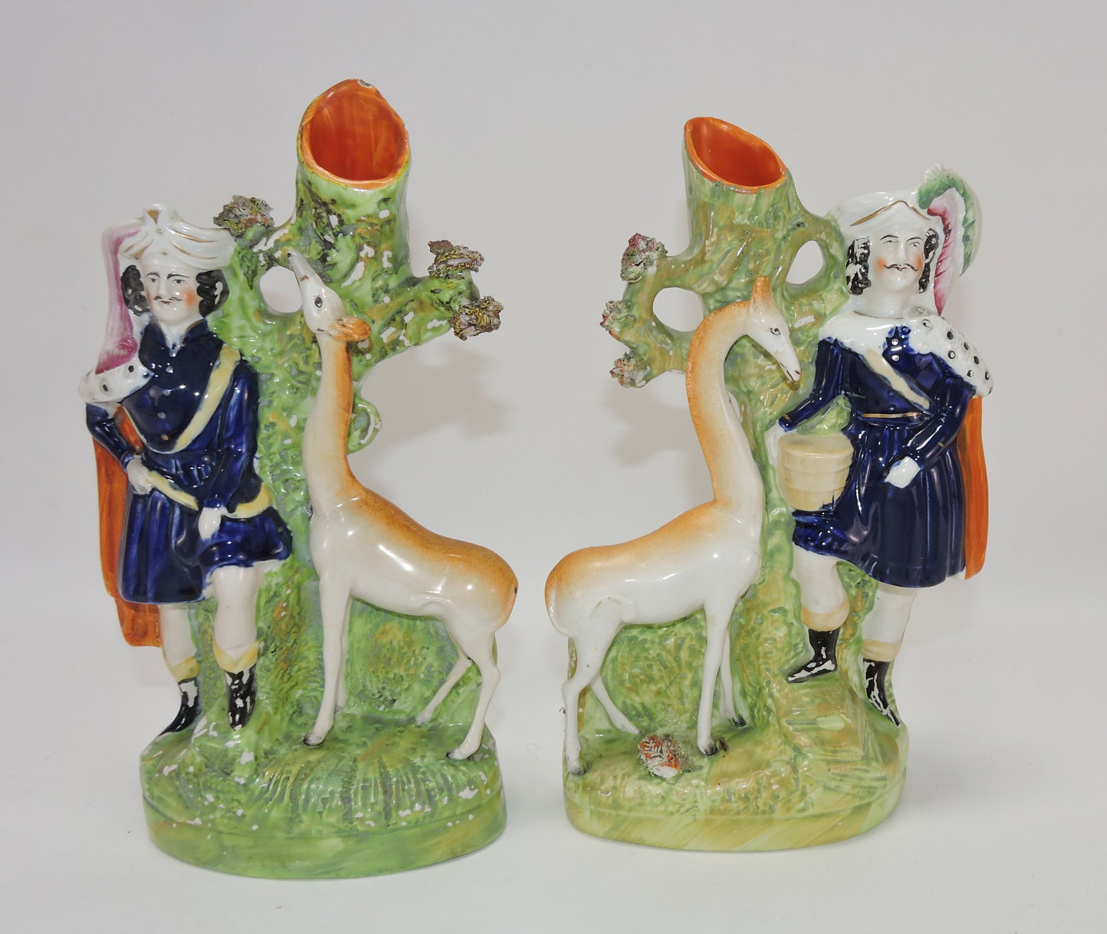 Staffordshire pair of giraffe spill vases,: 10"