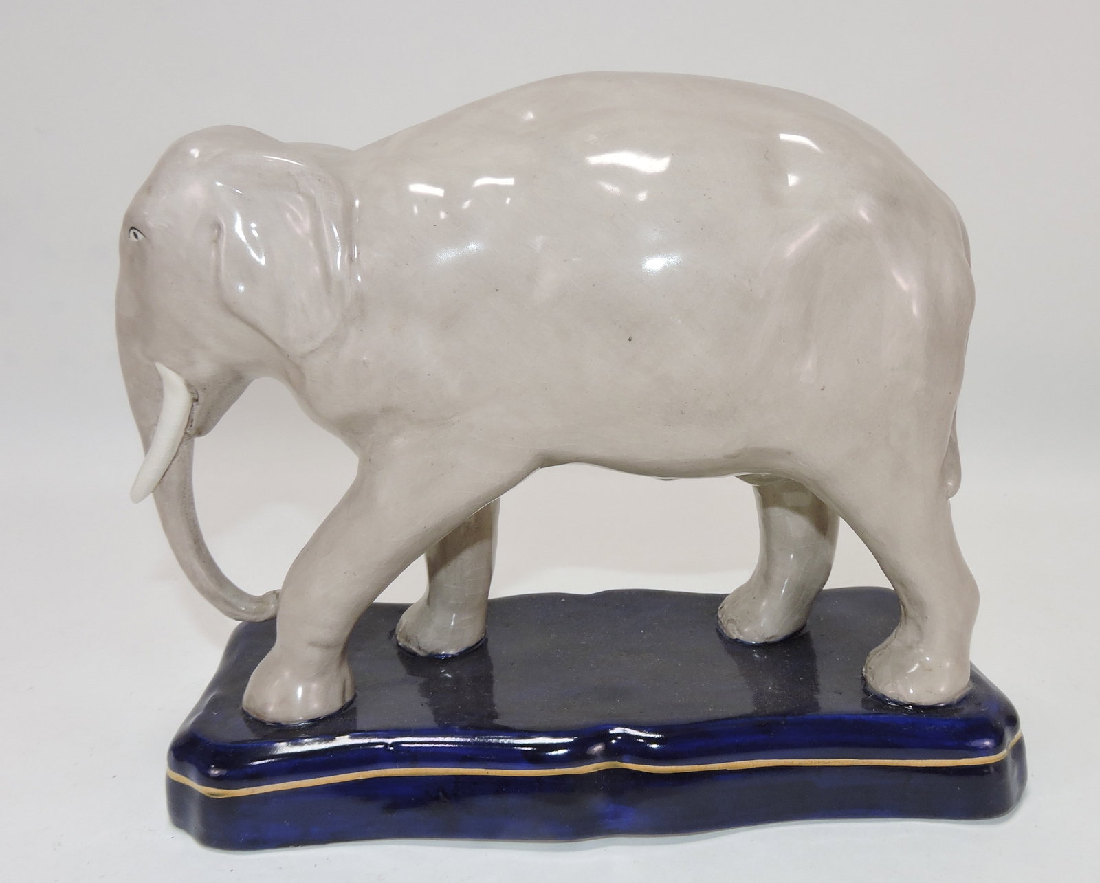 Staffordshire elephant on cobalt stand, (1 of 2)