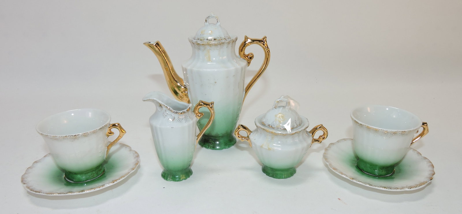 Porcelain child's tea set - teapot, cream,: sugar, 2 cups/saucers