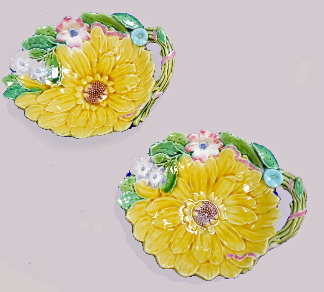 A pair of Minton majolica sunflower and floral: ice trays, modelled as a sunflower with leaf and flower border, twig handle, great color, rare form, 6 1/2"; impressed Minton mark and date code for 1873, shape no. 1691