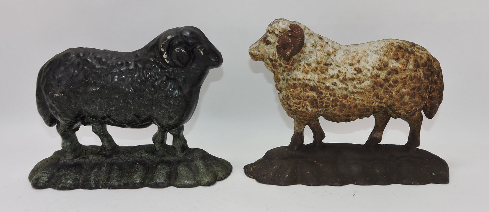 Cast iron lot of 2 ram doorstops, 7": .