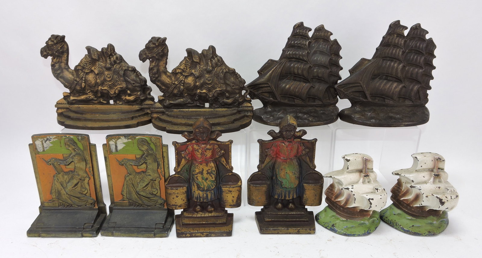 Cast iron lot of 5 pair of bookends,: 4" to 6"