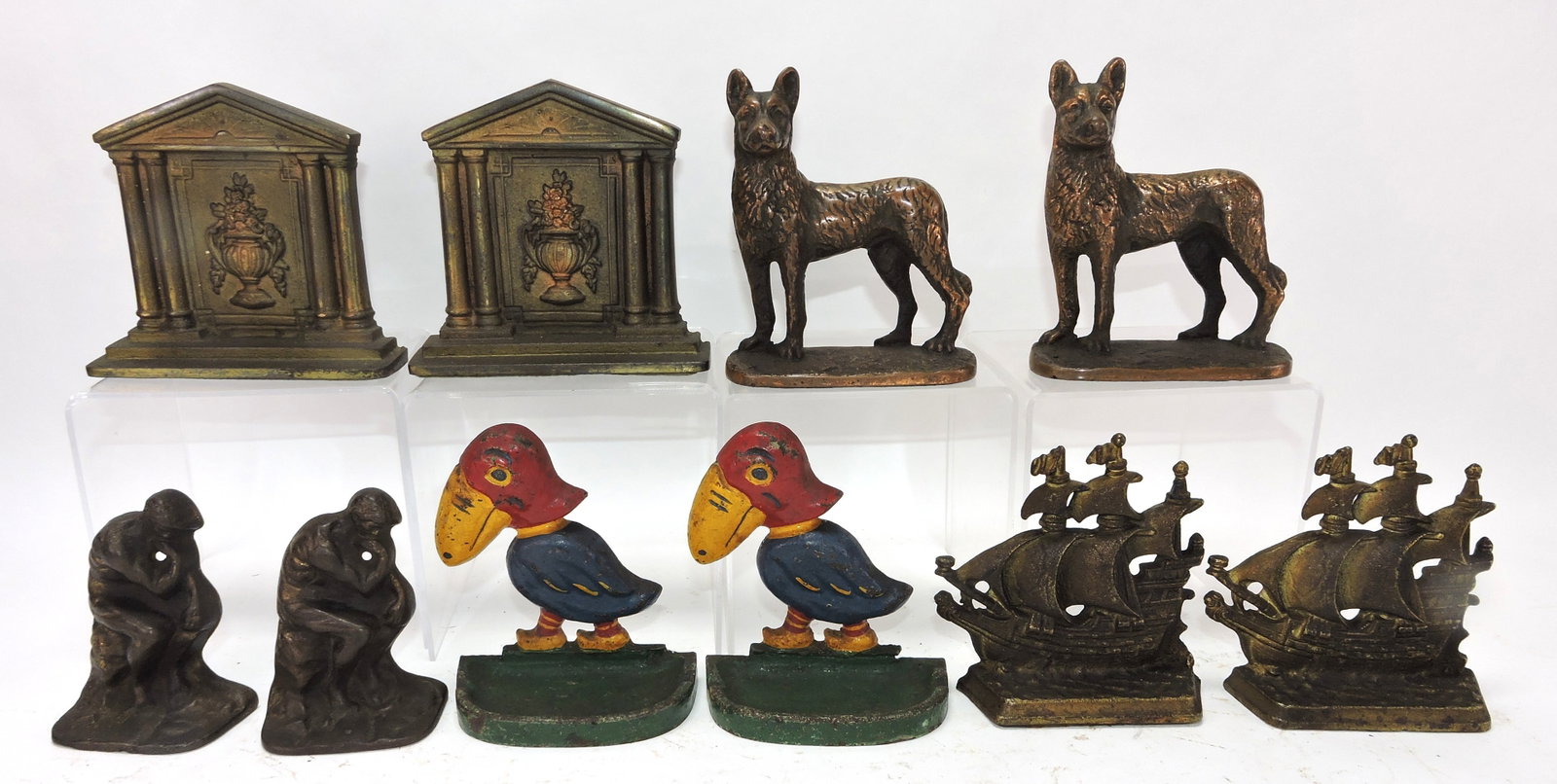 Cast iron lot of 5 pair of bookends,: 4" to 5"