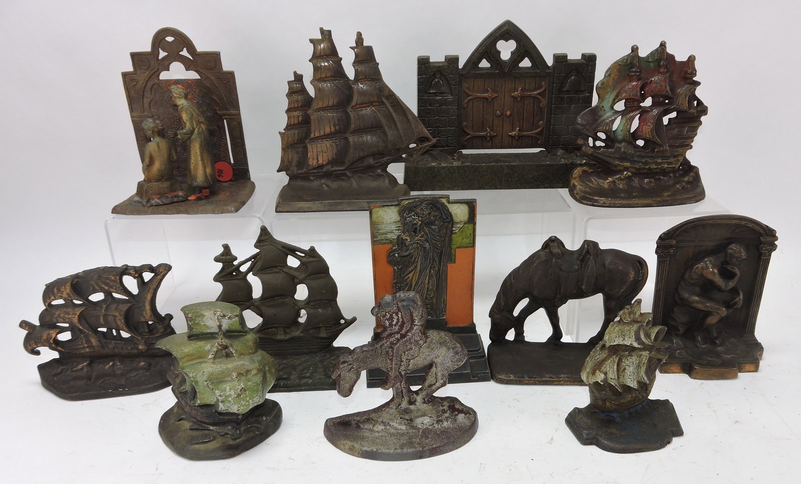 Cast iron lot of 12 single bookends,: 4" to 6"