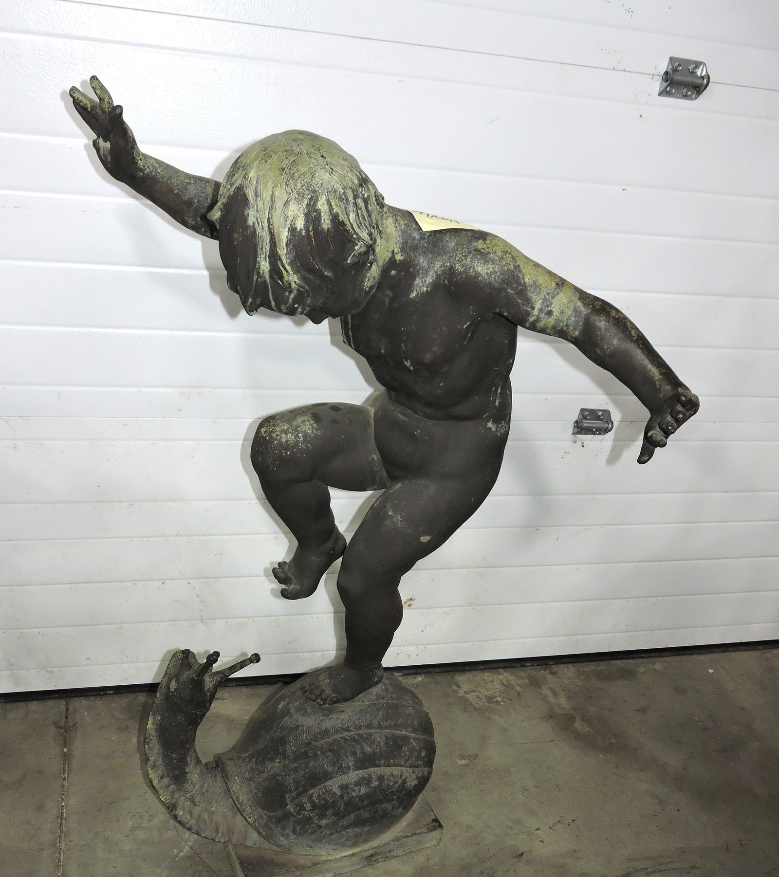 Large bronze sculpture of young boy (1 of 3)