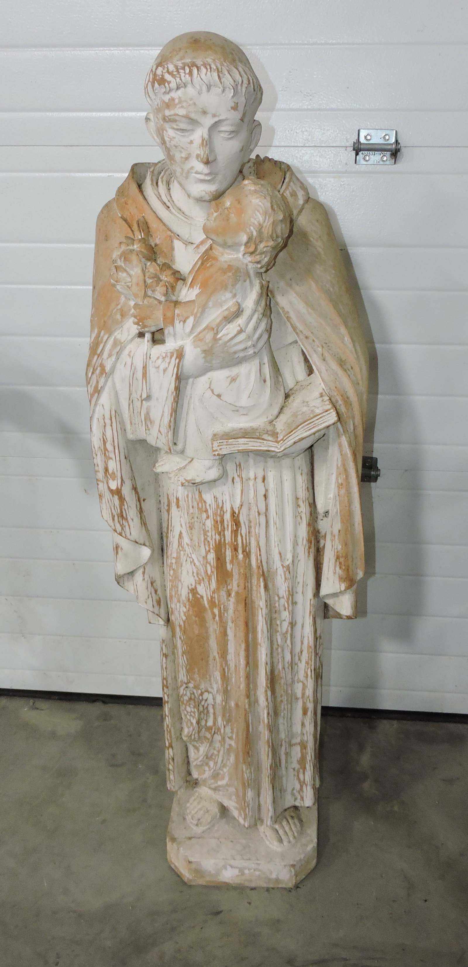 Wooden carving of priest with child, (1 of 1)