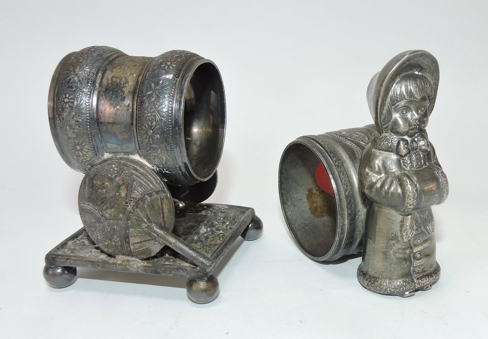 Lot of 2 silverplated figural napkin rings: .