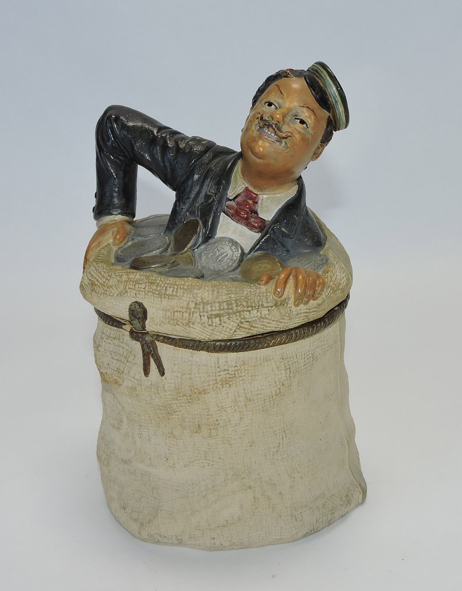 J. Maresch terra cotta man in a: money sack figural tobacco jar, 8", ref. Figural Humidors by Horowitz #781