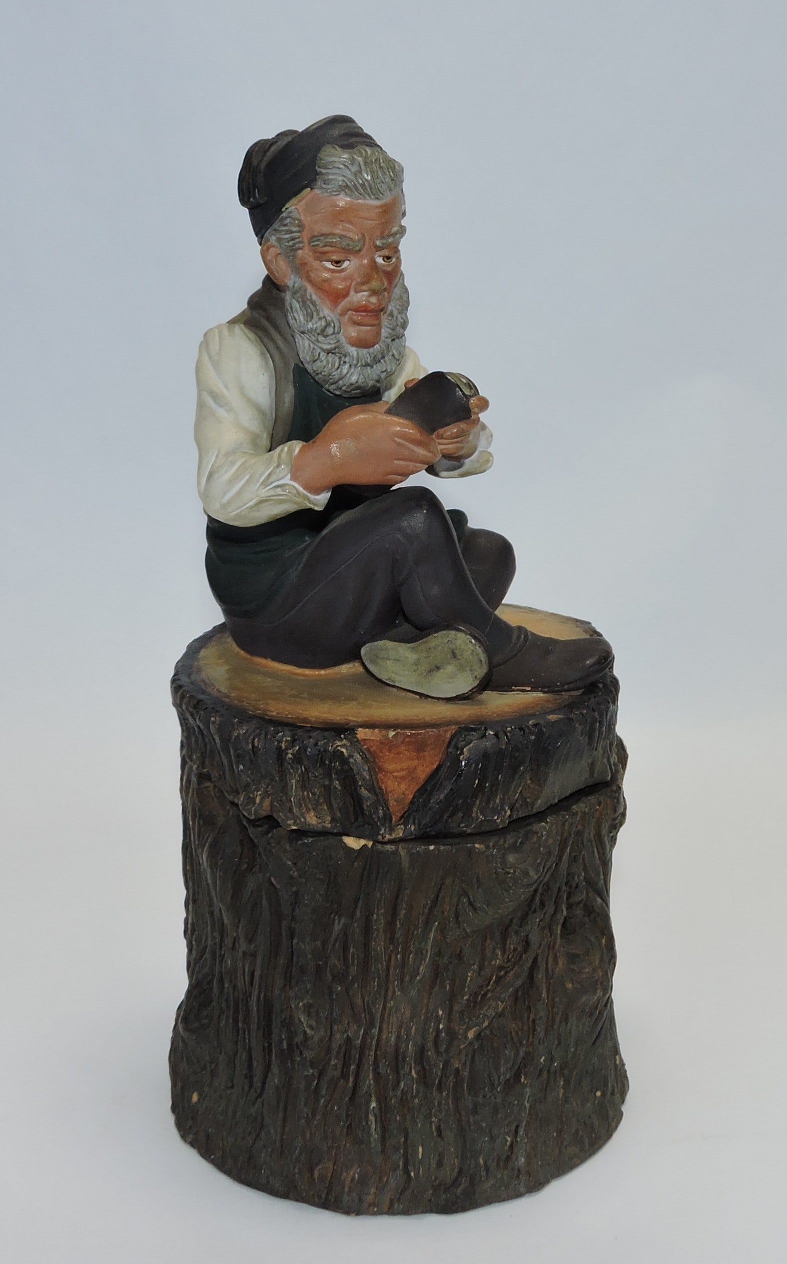 Terra cotta shoe cobbler atop a tree (1 of 1)