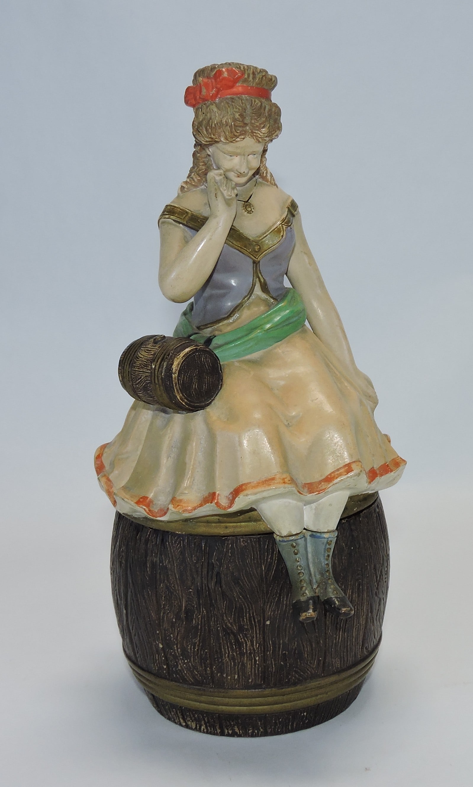 Terra cotta lady atop a barrel figural (1 of 1)