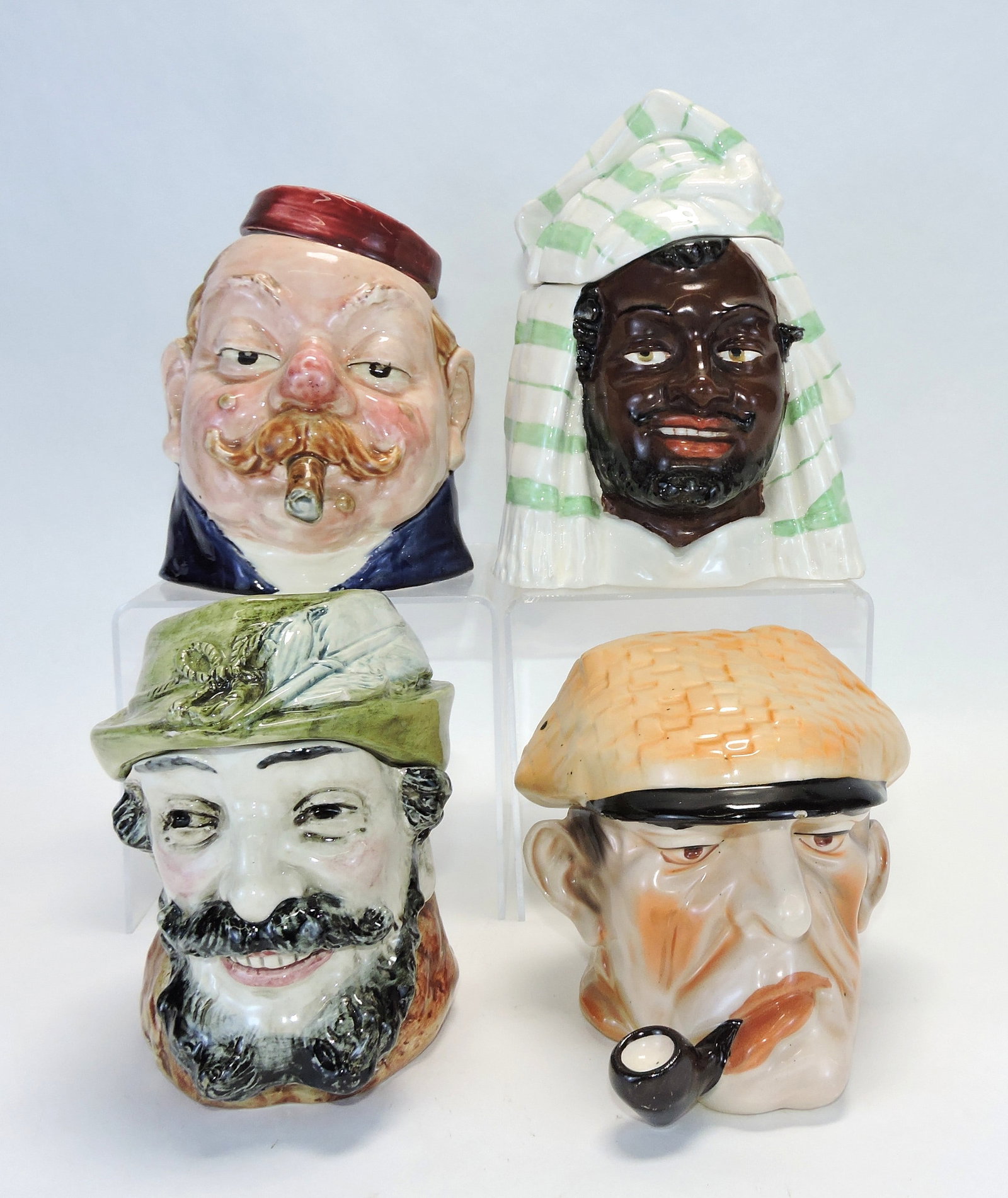 Majolica lot of 4 figural tobacco jars: of people heads, 5" to 7", various condition