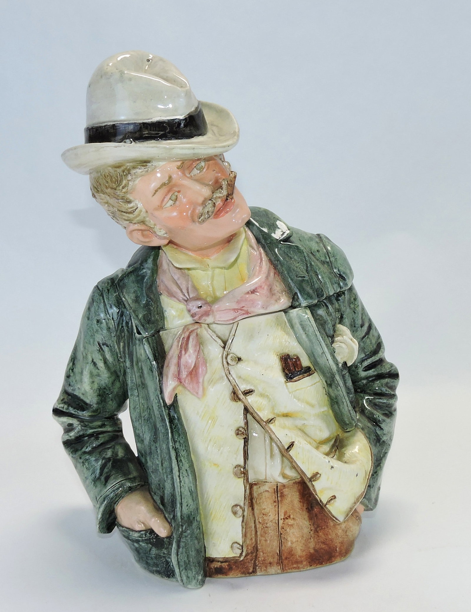 Majolica large figural tobacco jar: of a finely dressed gentleman with cigar, 11 1/2"