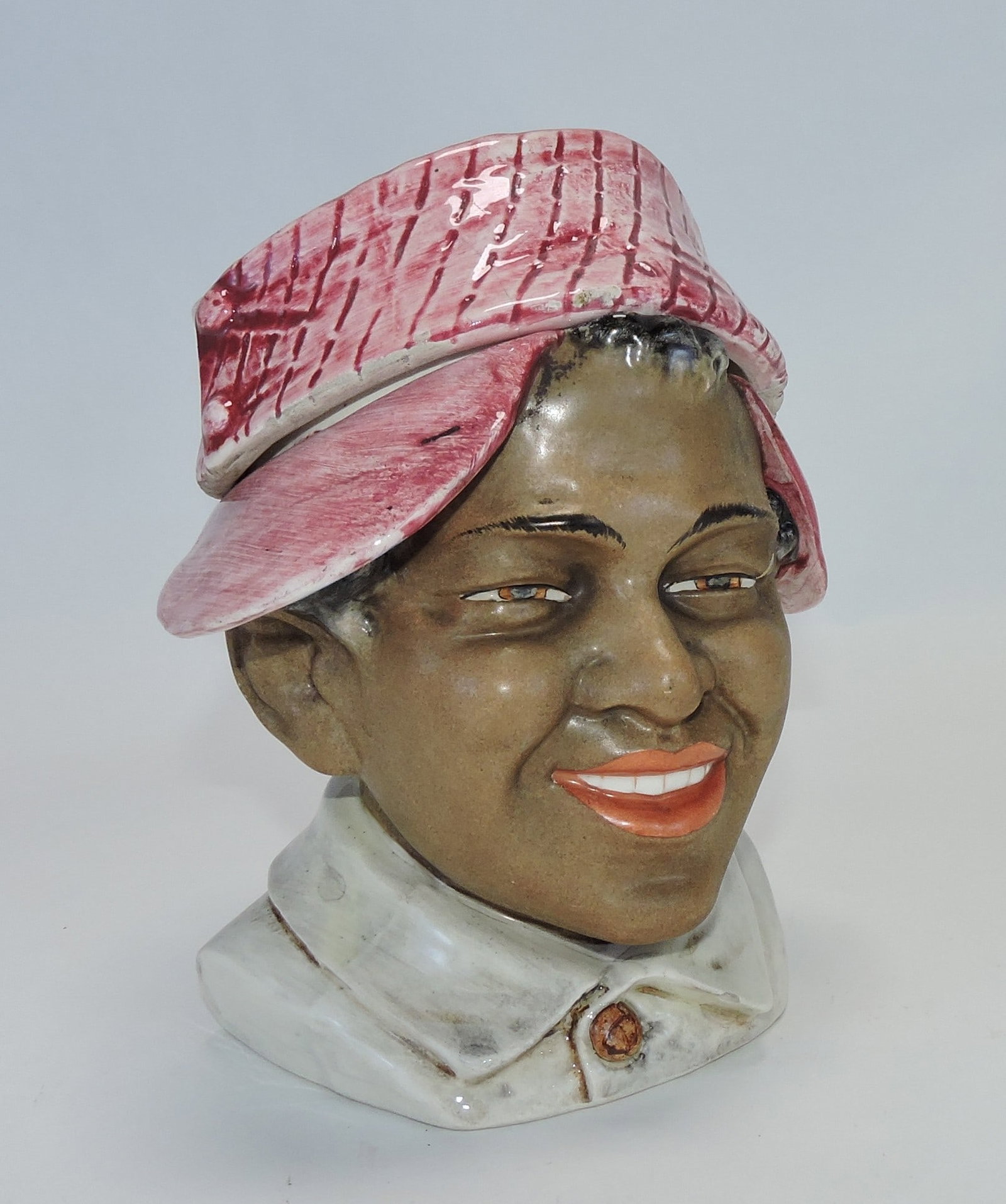 Majolica Black Americana figural tobacco: jar of a man with a cap, 6 1/2", ref. Figural Humidors by Horowitz #257