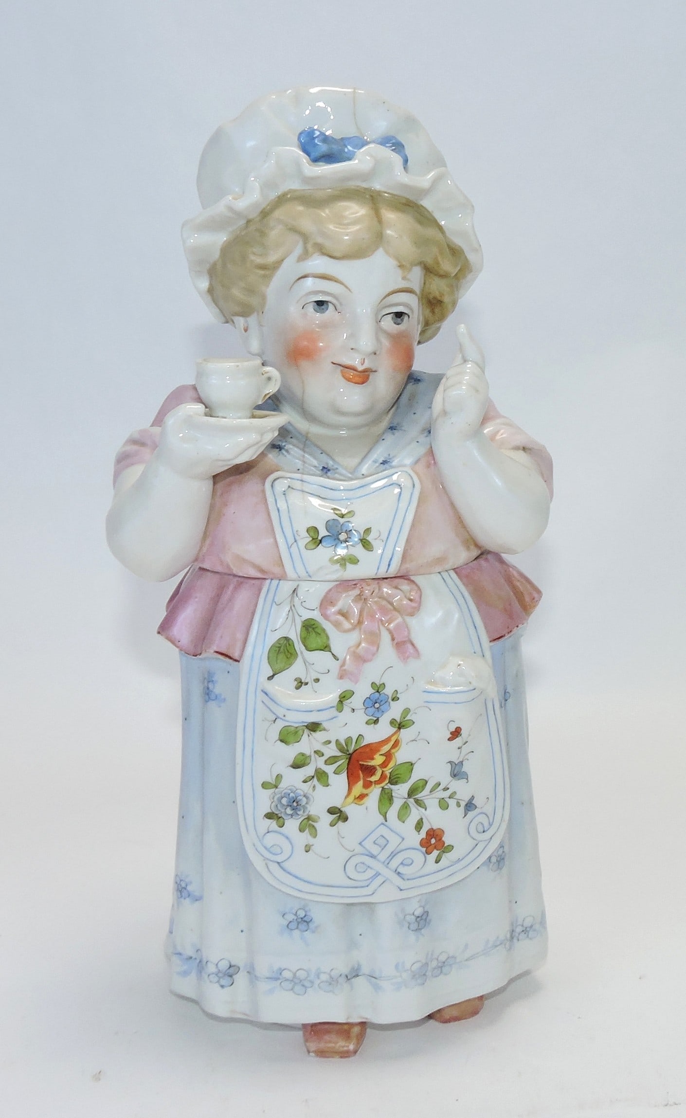 Conta & Bohme figural tobacco jar: of lady having tea, 10", hairline to lid