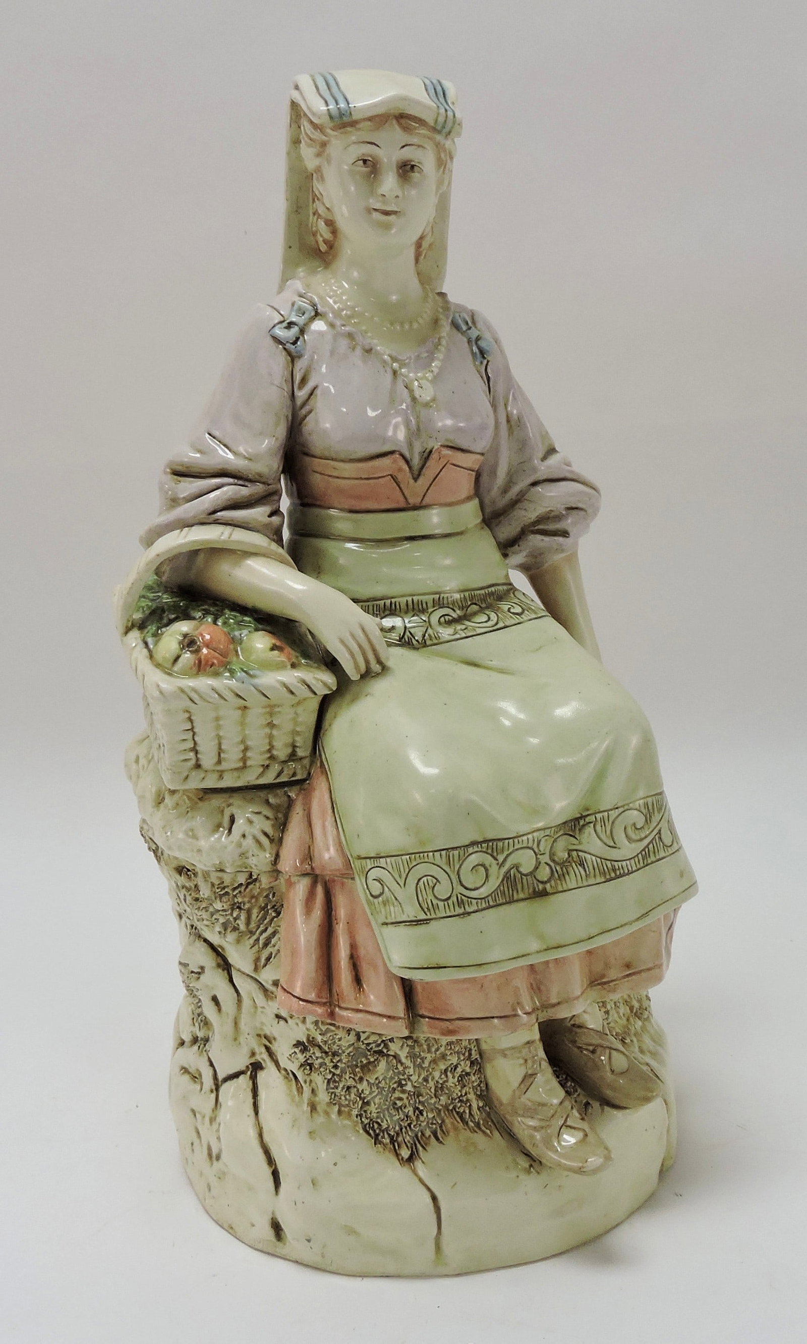 B. Bloch majolica figural tobacco jar: of a country lady with basket of fruit, 11"