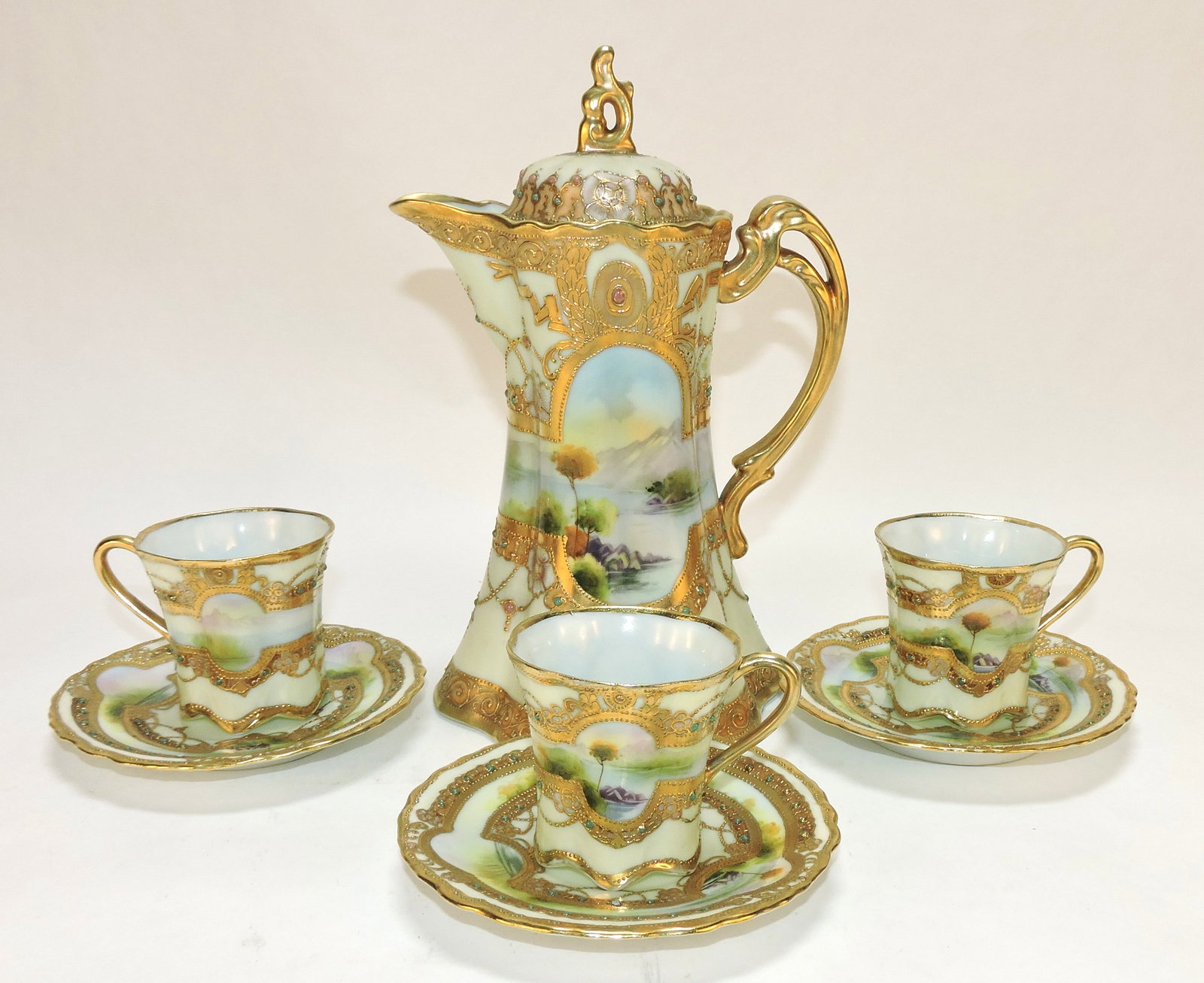 Nippon chocolate pot, 9 1/2", and: 3 cups/saucers, heavy gold and jeweled decor. The Dwight & Helen Wilmoth Collection