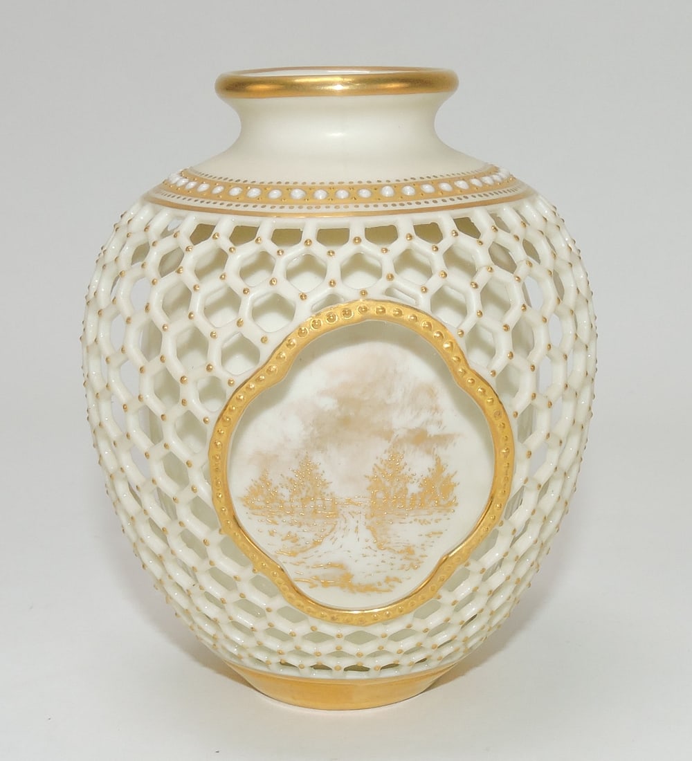 Royal Worcester double walled: reticulated porcelain vase, most likely by George Owen, ovoid form, the outer wall reticulated with honeycomb lattice and gild beaded decor and three quatrefoil panets with gilt landscapes, 4 1/4"