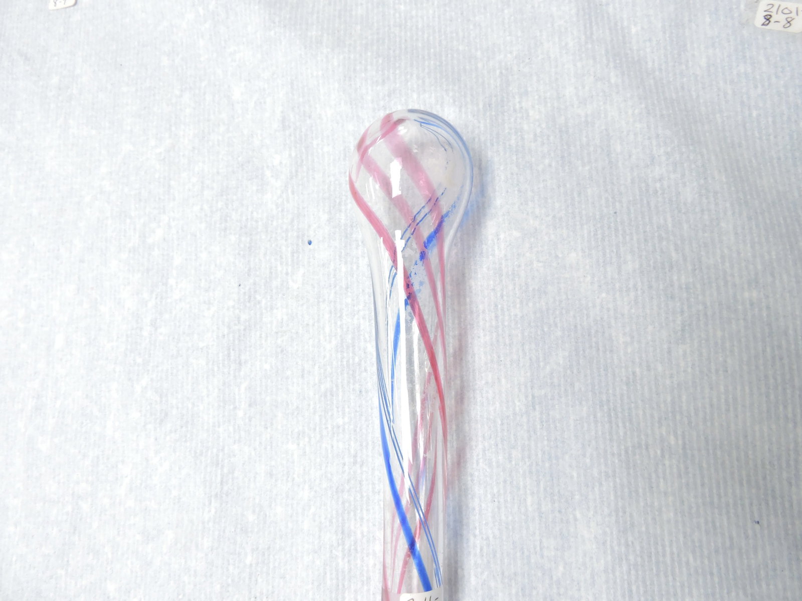Glass parade cane, red, blue, and (1 of 2)