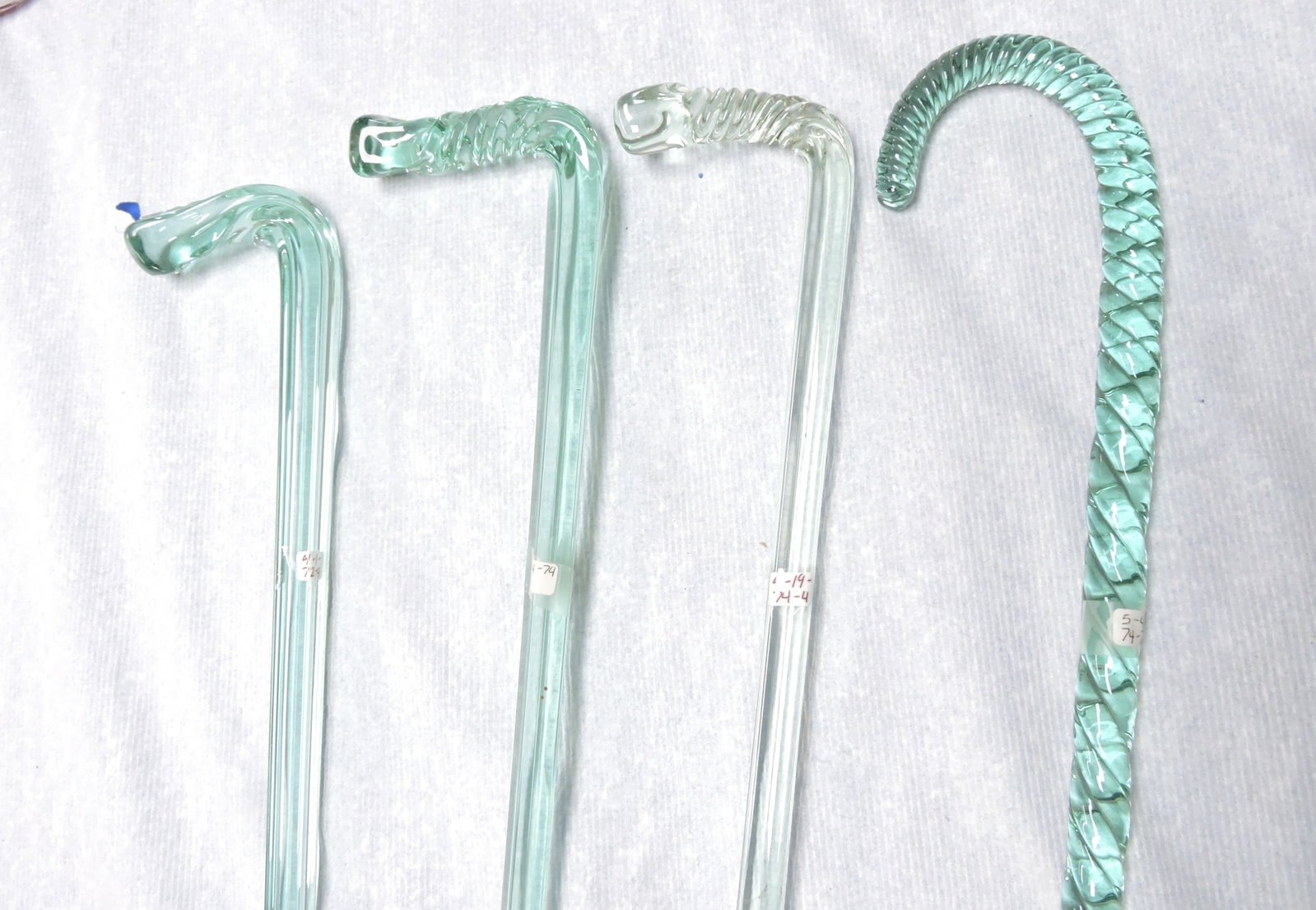 Lot of 4 glass canes, 34" to 44" (1 of 2)