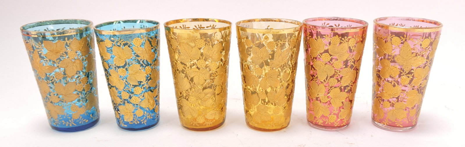 Moser set of 6 - 4" tumblers with: heavy gold blackberry and vine motif, 2 blue (chip to one), 2 amber, 2 cranberry