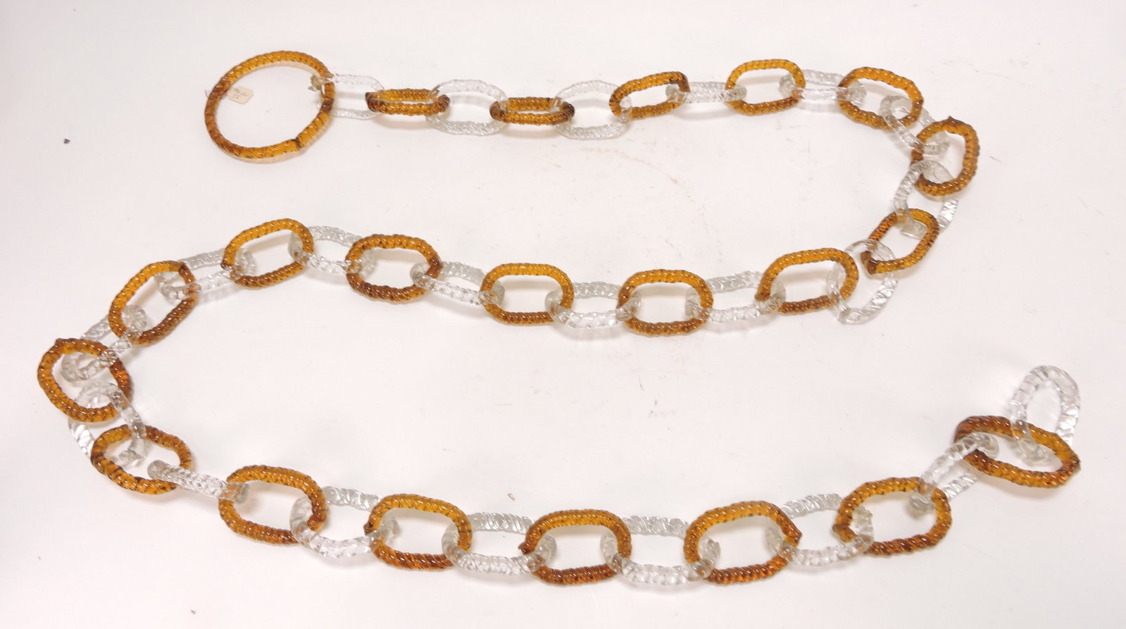 Amber and clear glass chain, 72": .