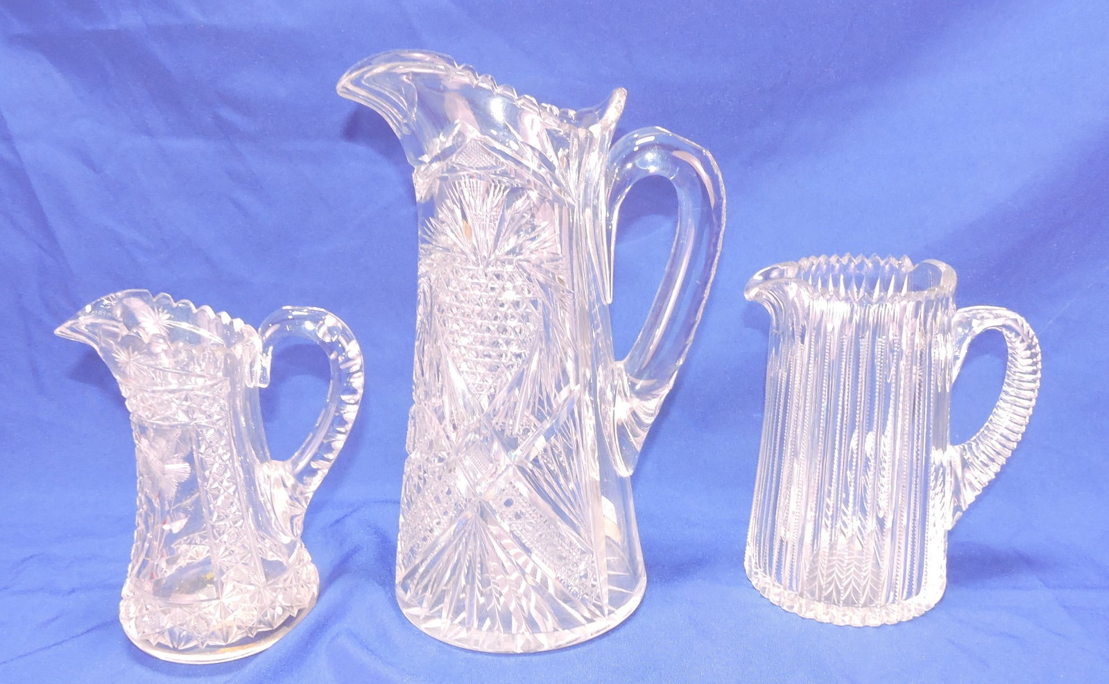Cut glass lot of 3 pitchers, 7" to 11": .