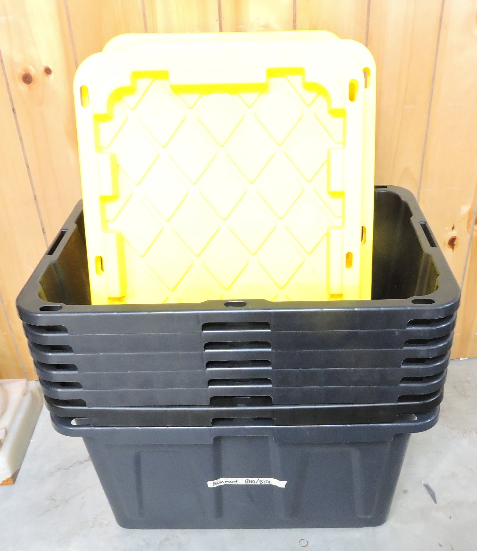 Lot of 7 black/yellow plastic totes with: lids