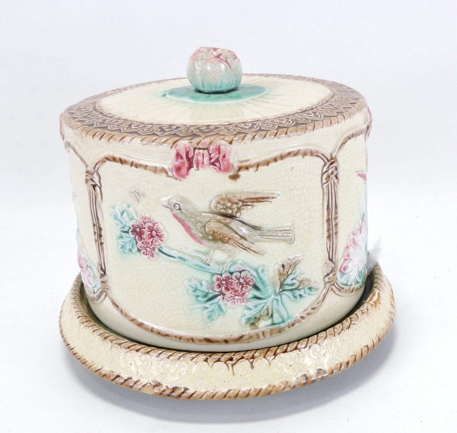Majolica bird on branch and water lily (1 of 3)
