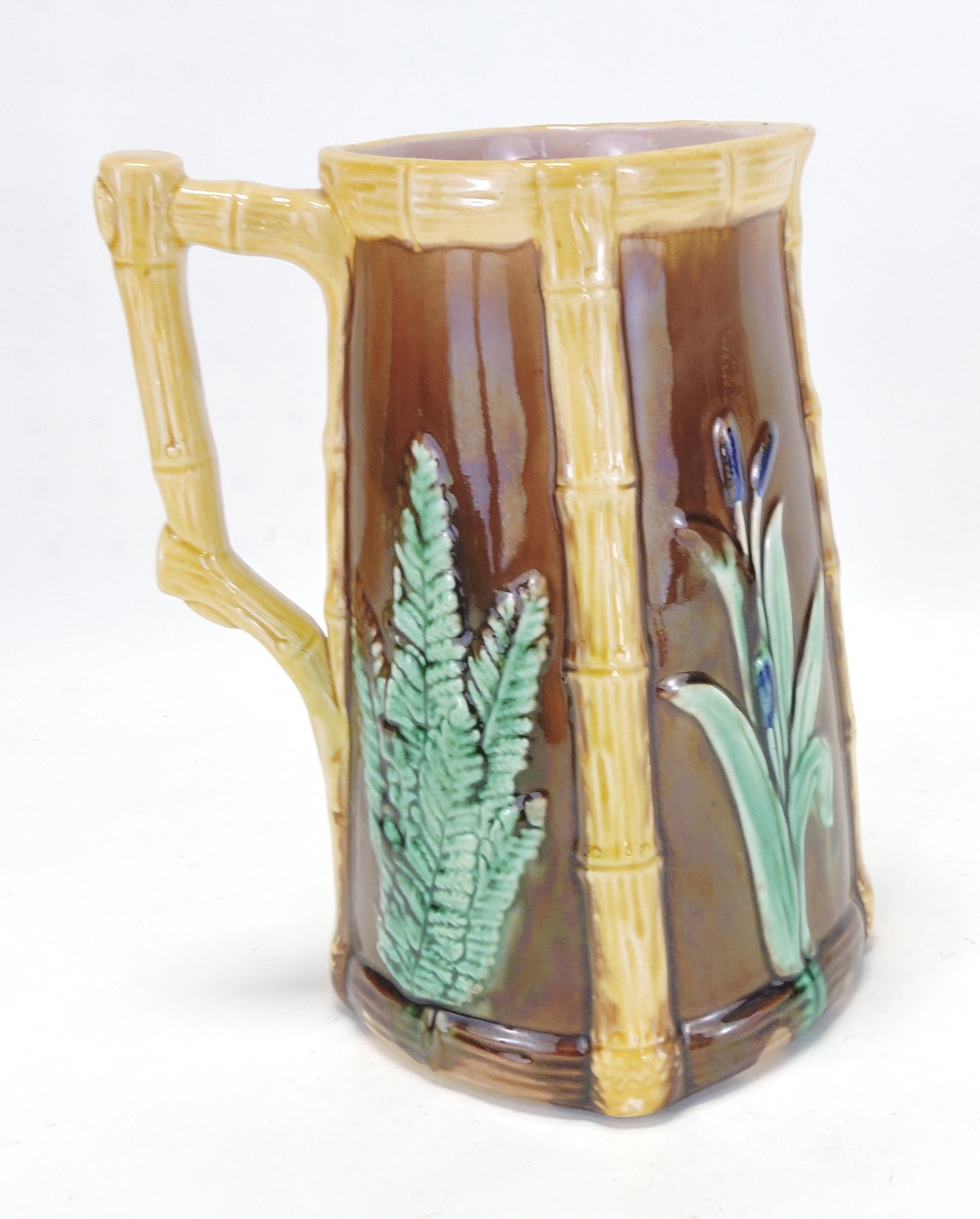 Majolica pitcher with cattails, ferns,: and bamboo, 9"