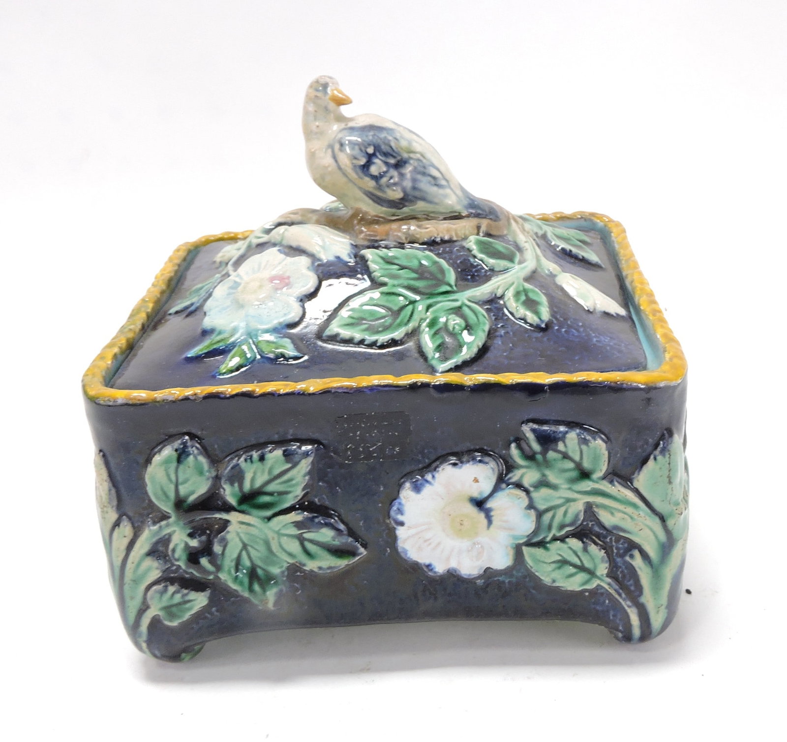 Cobalt majolica sardine box with: bird finial, hairline repair to lid