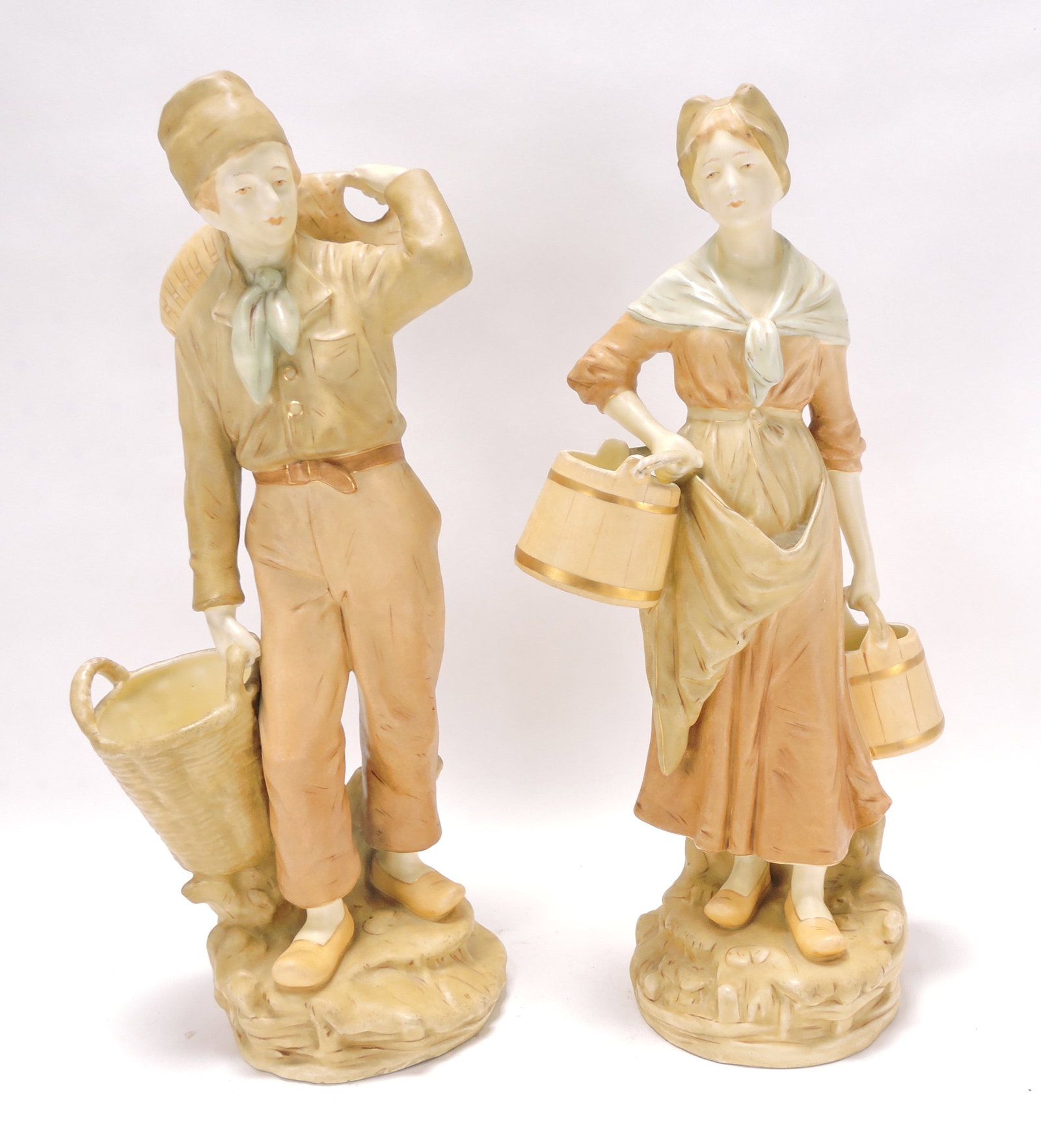 Pair of Royal Dux (attributed) bisque: figures of Dutch man and woman going to market, 17"
