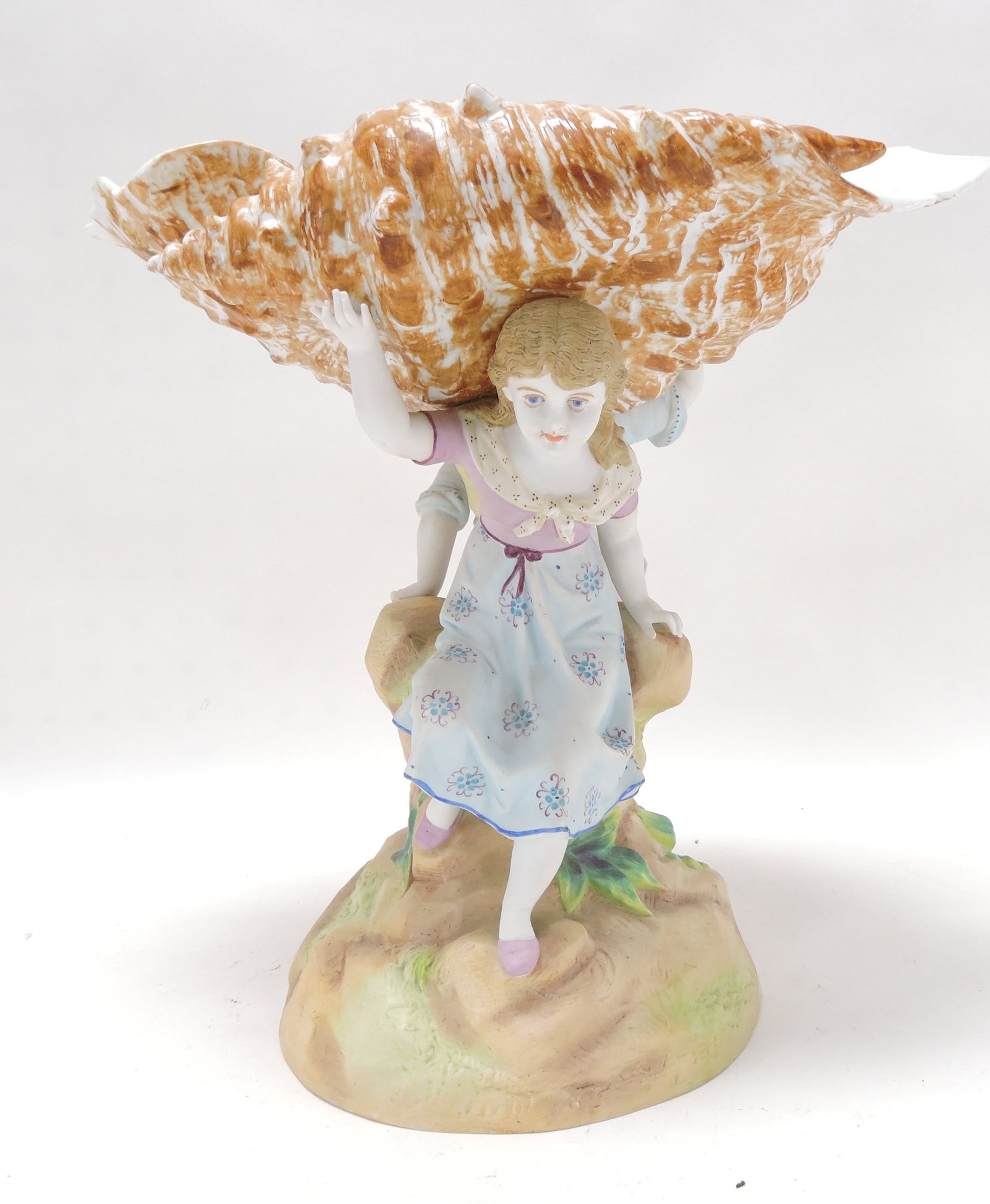 Bisque/porcelain figure of boy and girl: supporting a large shell, 13"