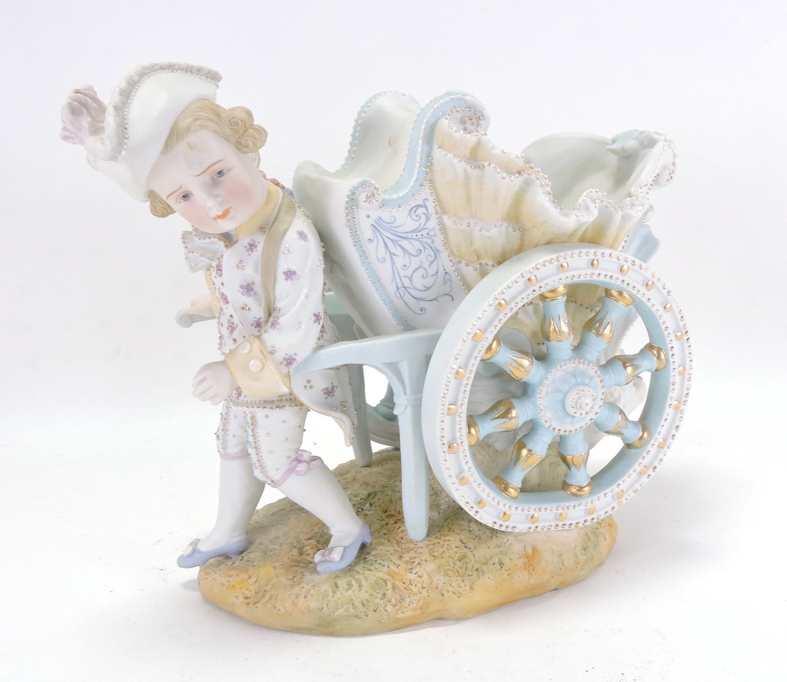 Bisque figure of a child with a chariot, (1 of 2)