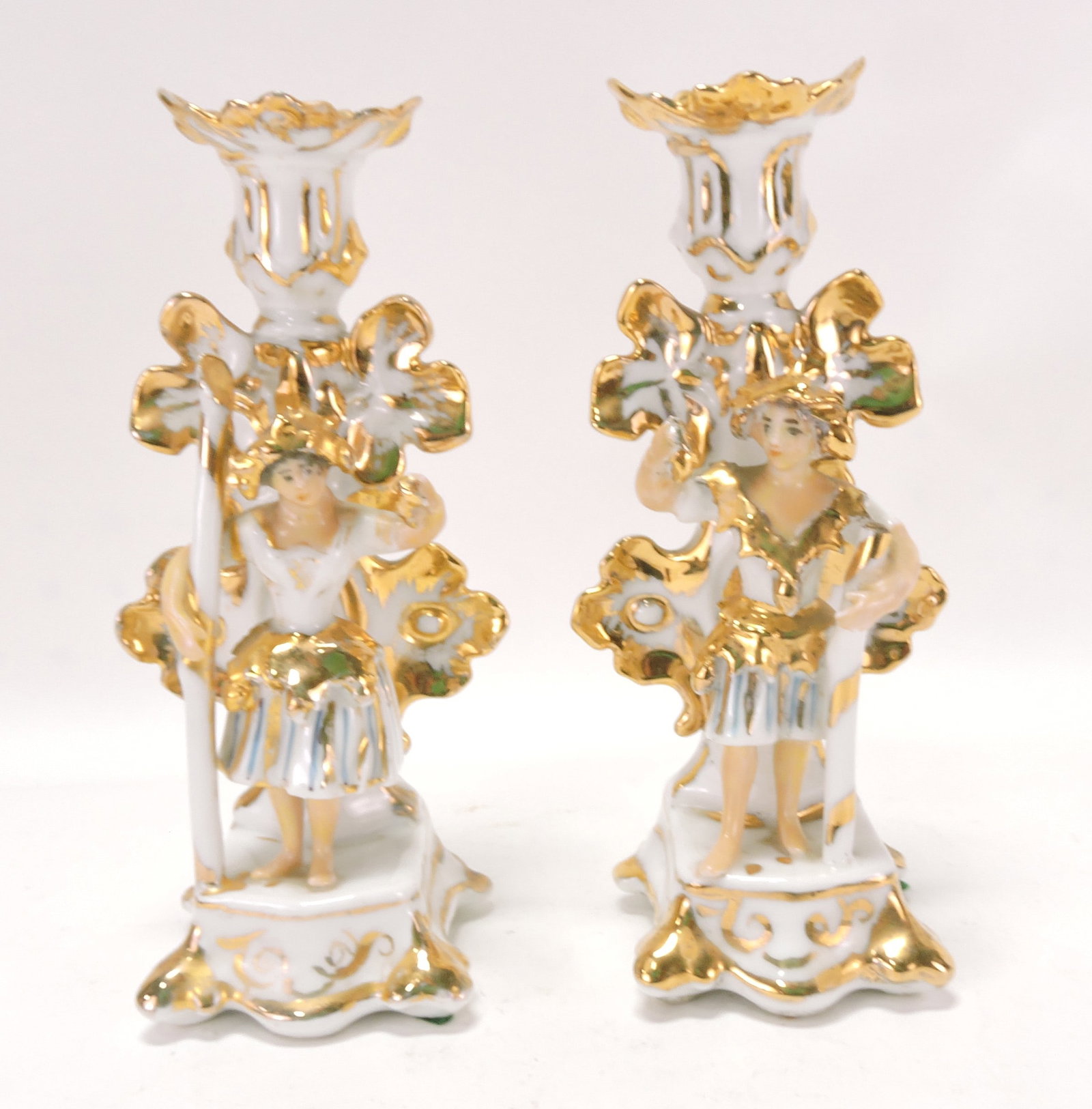 Porcelain pair of gilted candle sticks, (1 of 2)