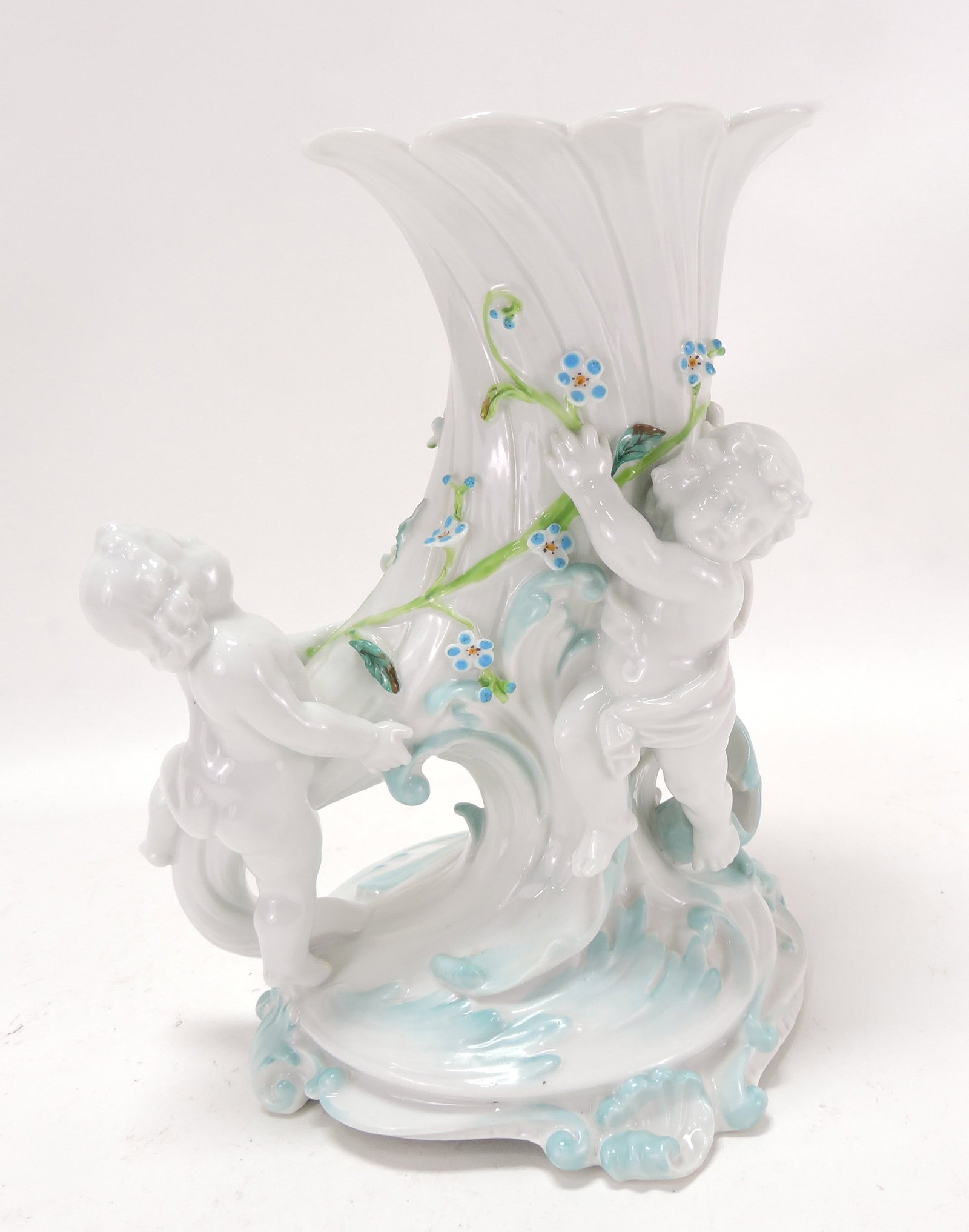 Porcelain figural vase in the form of a: cornucopia with two cherubs, 9"