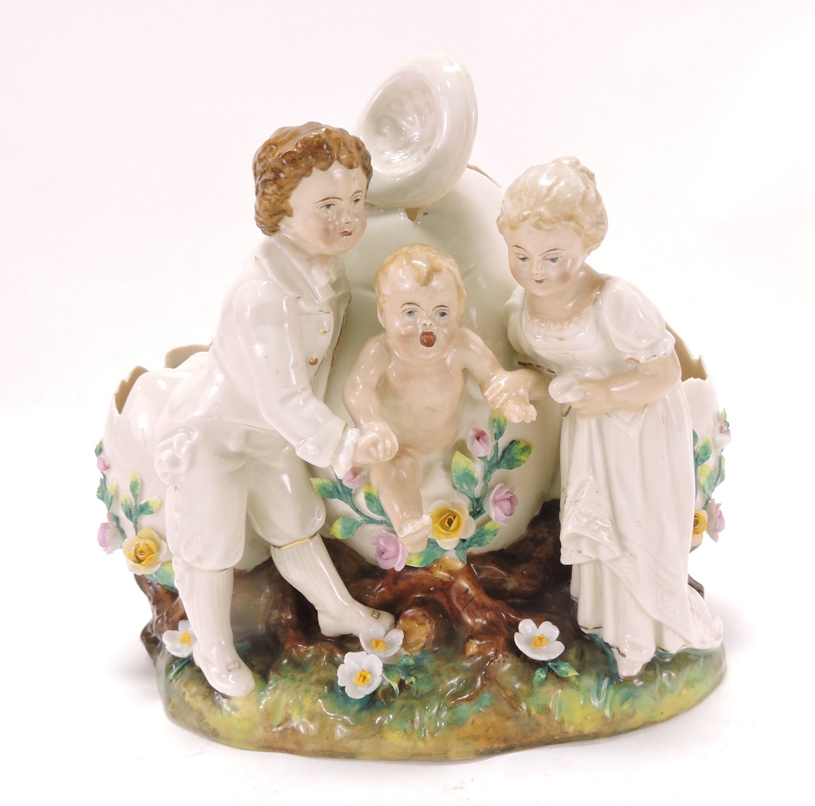 Porcelain figural group of parents with (1 of 2)