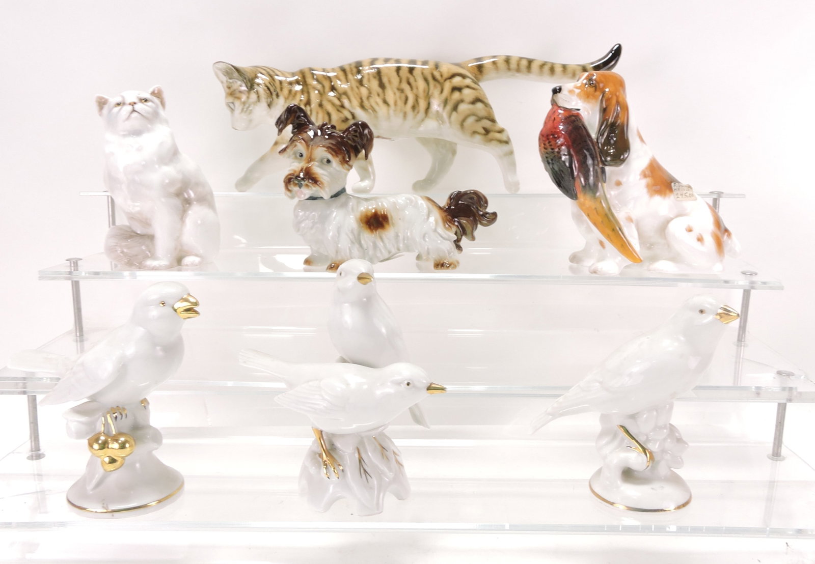 Porcelain lot of 7 figures:: Hutschenreuther cat 12", Royal Doulton cat & dog, German dog, and 3 German Erphila birds
