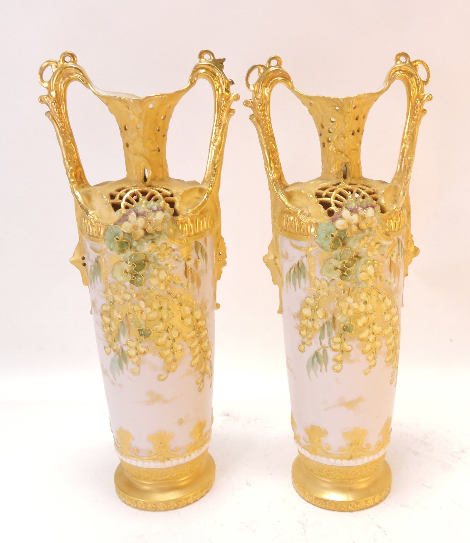 Amphora style pair of reticulated vases,: loss of point of one handle, 13"