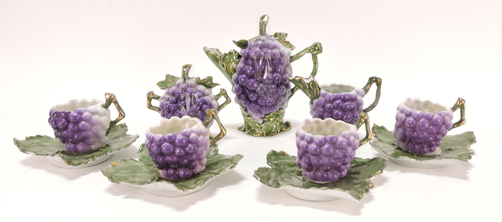 Porcelain child's tea set with grapes: .