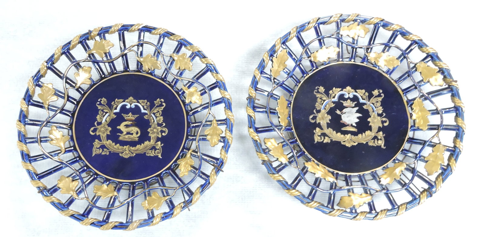 Porcelain pair of crest plaques, 10": .