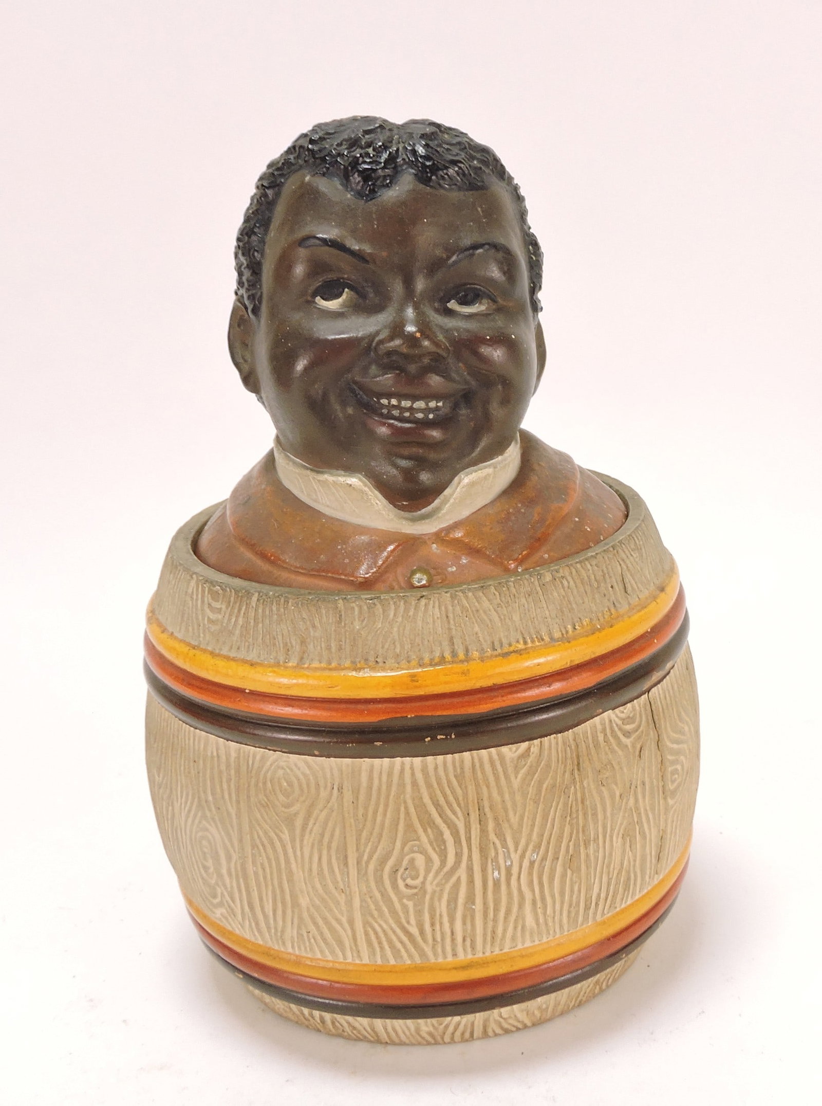 Black Americana J. Maresch terra: cotta humidor of man in barrel, 7 1/2"