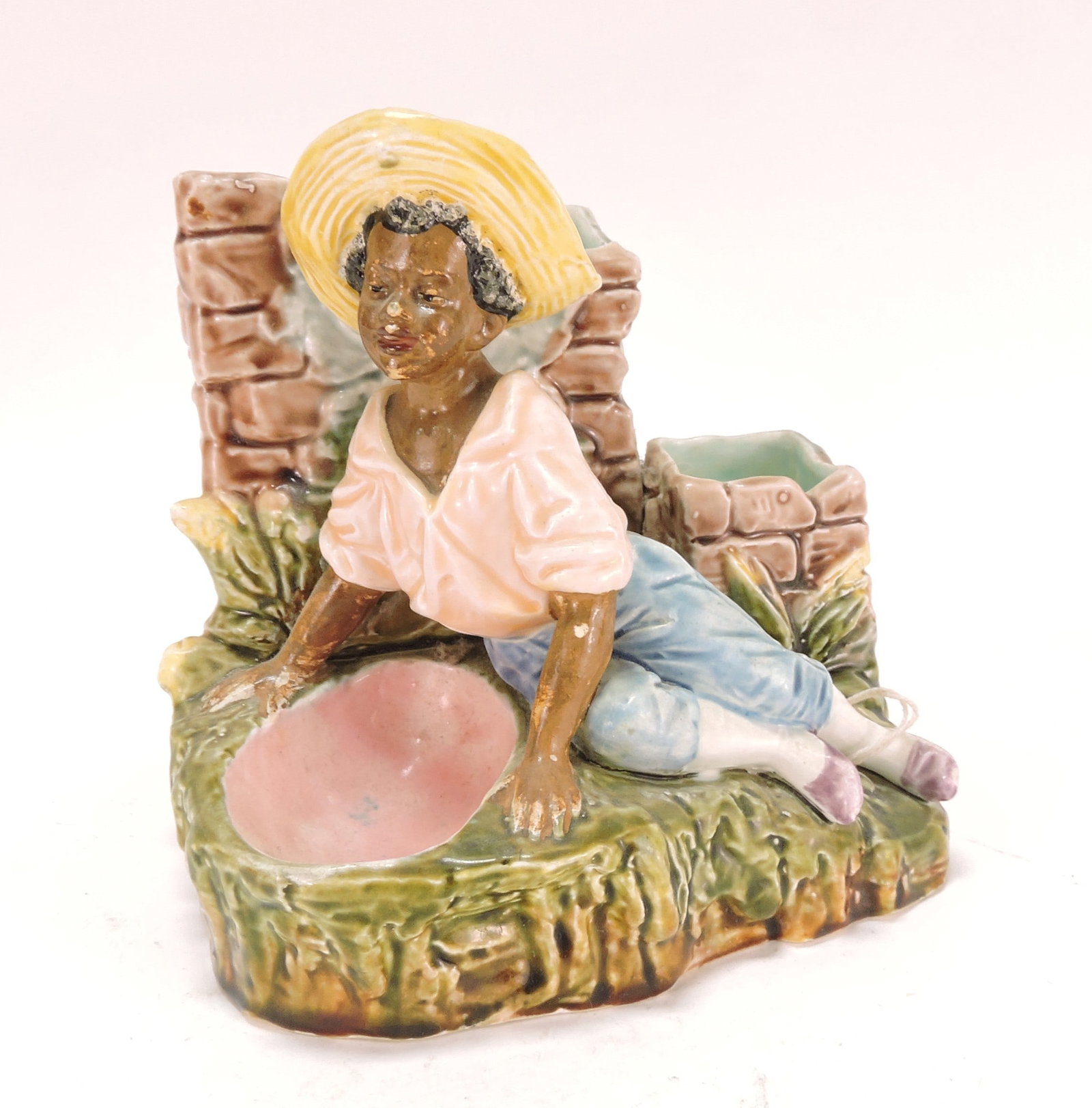 Black Americana majolica figural: match striker of recumbent man, 6", minor nick