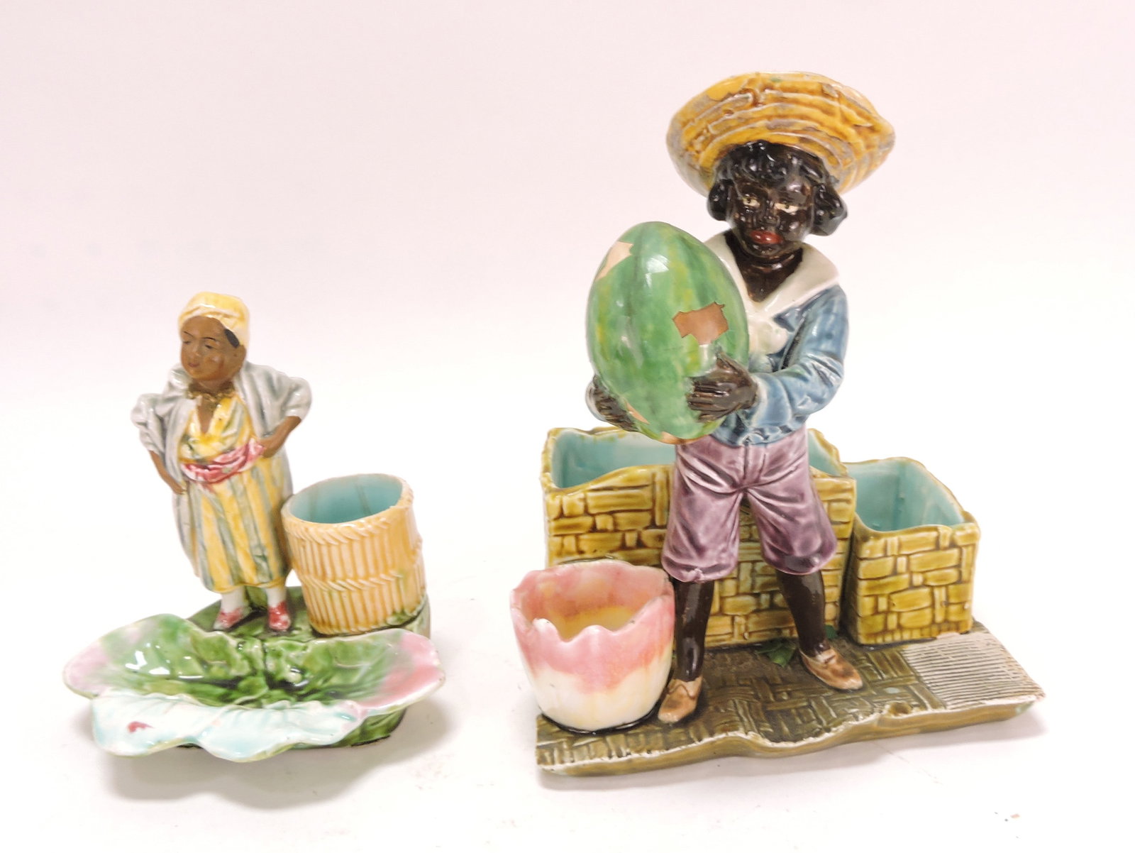 Black Americana majolica figural: lot of two, 1 - 5", 1 - 7 1/4" (repaired)