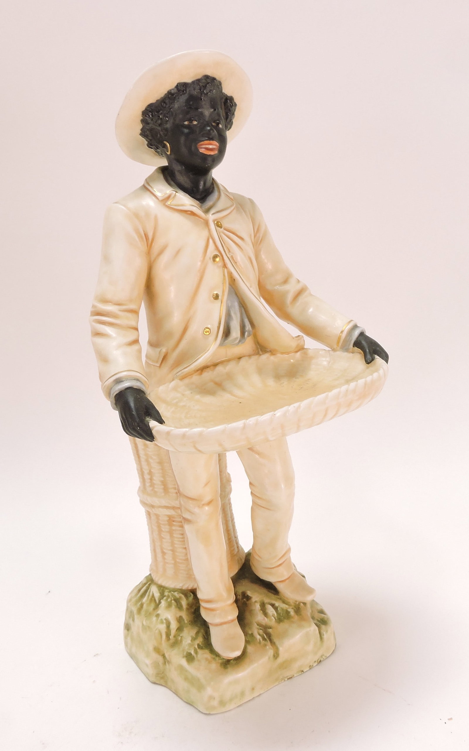 Black Americana Bernard Bloch: majolica figure of man with basket, 13"