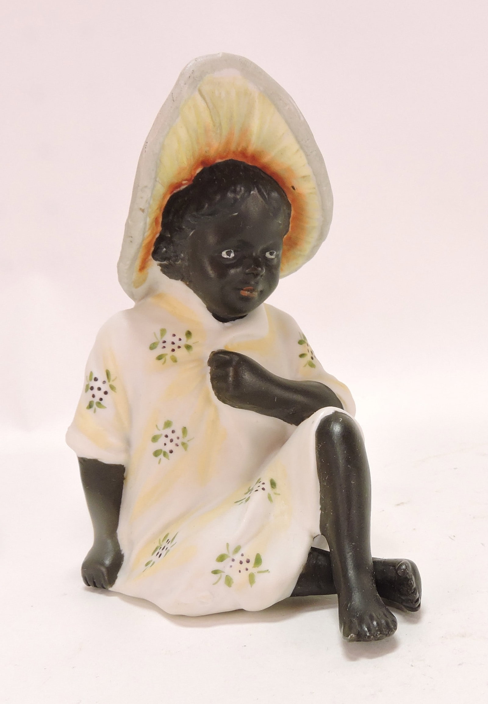Black Americana bisque figure of: girl with bonnet, 4 3/4"