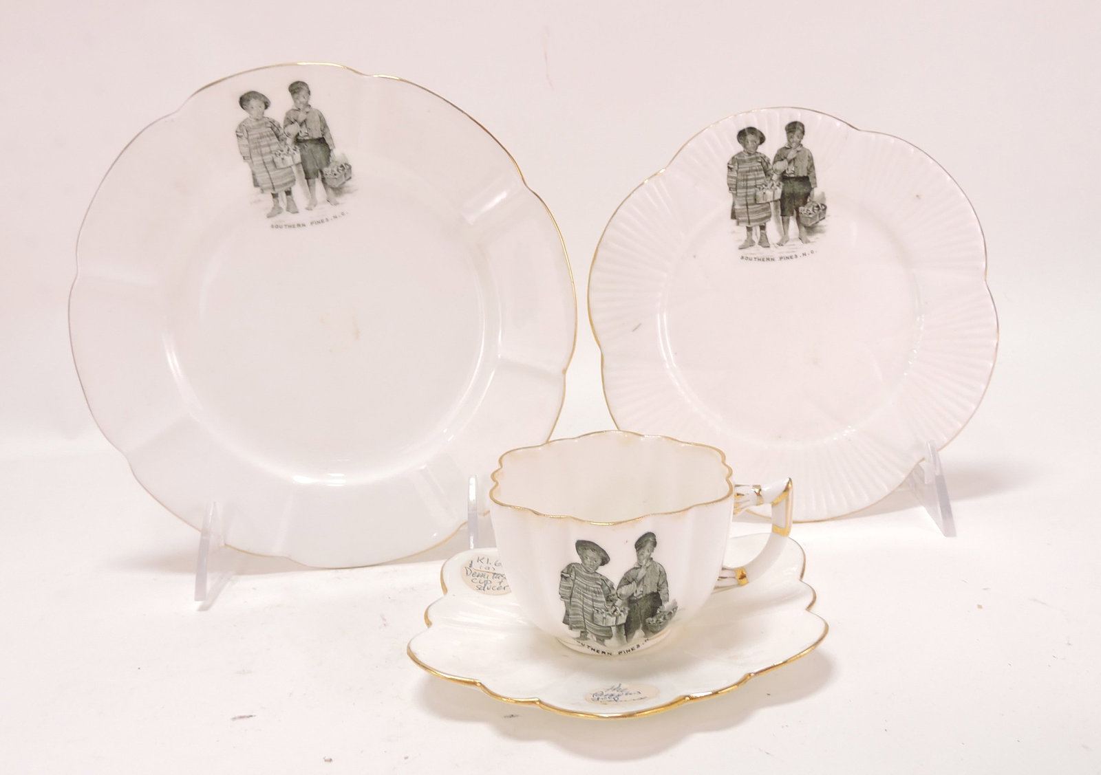 Black Americana 'Southern Pines': porcelain lot of 2 plates and demitasse cup & saucer