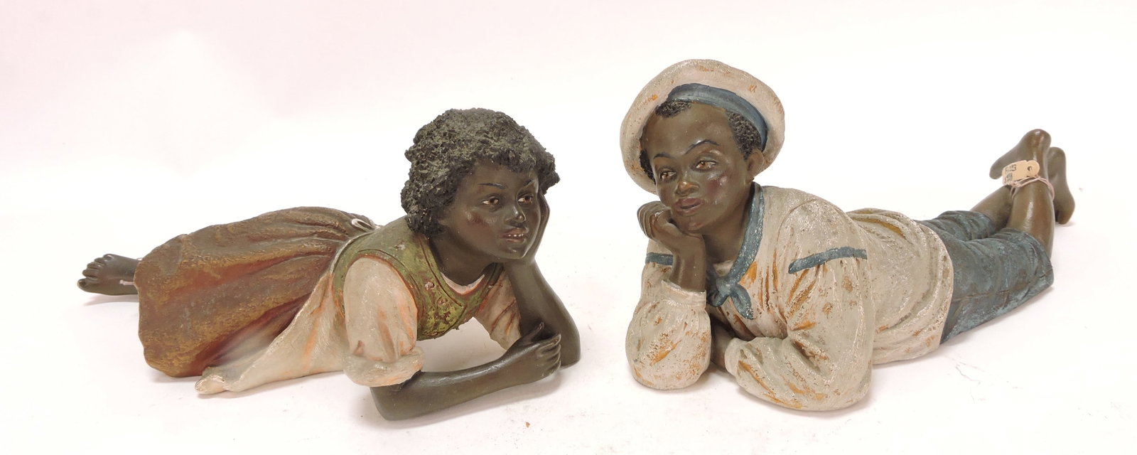 Black Americana Bernard Bloch: terra cotta pair of recumbent figures, 7"