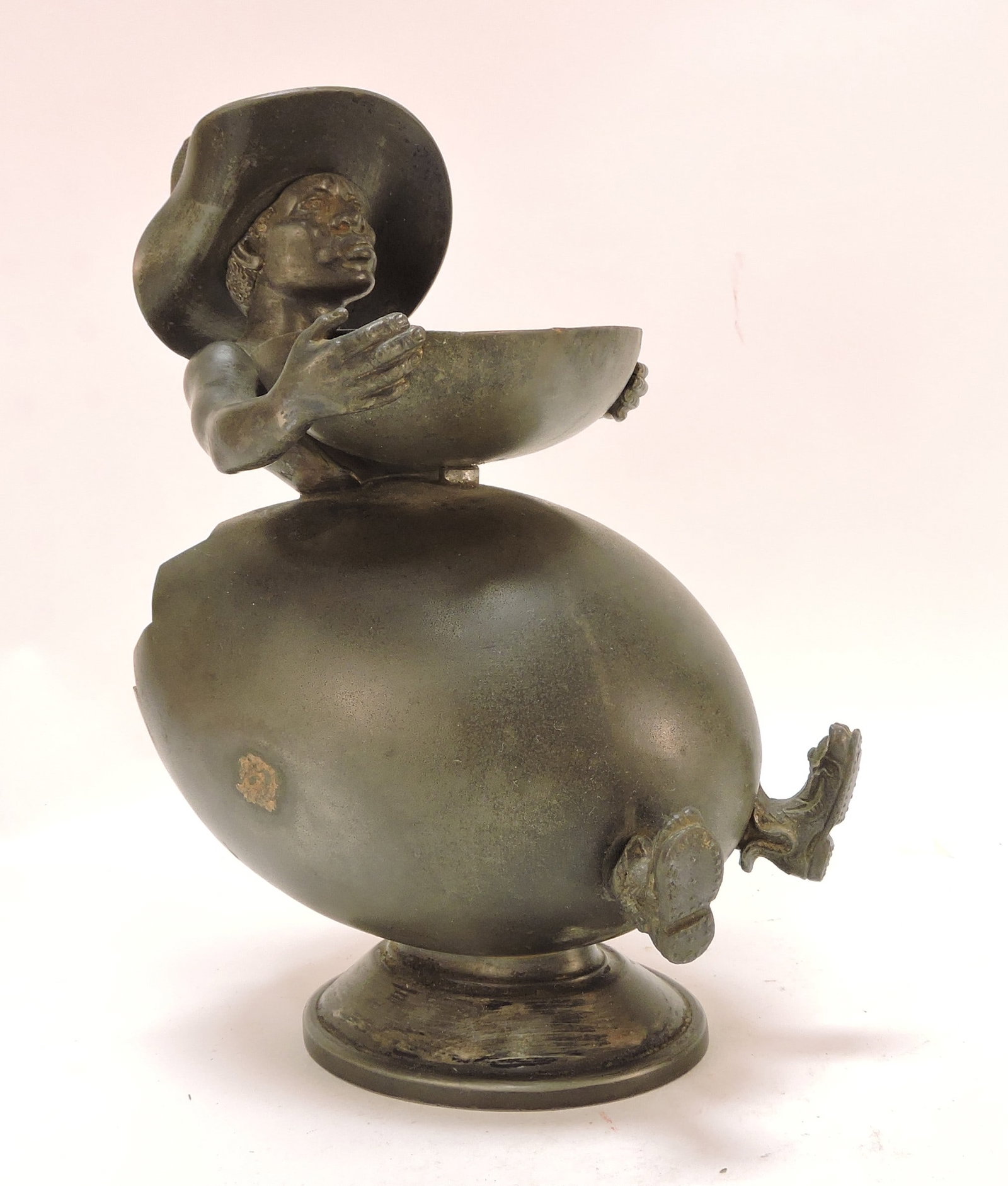 Black Americana metal figural smoking: set of man in an egg (cigar holder) with top hat (match holder) holding a basket (ashtray), 9"