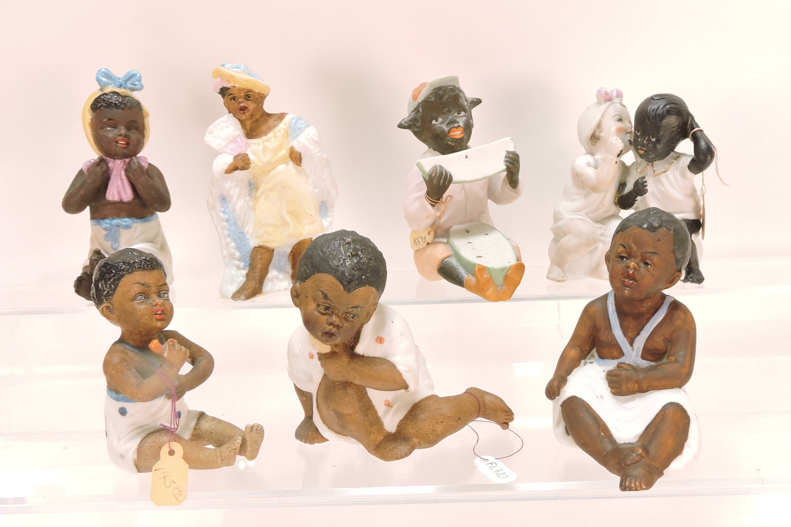 Black Americana bisque lot of 7 figures,